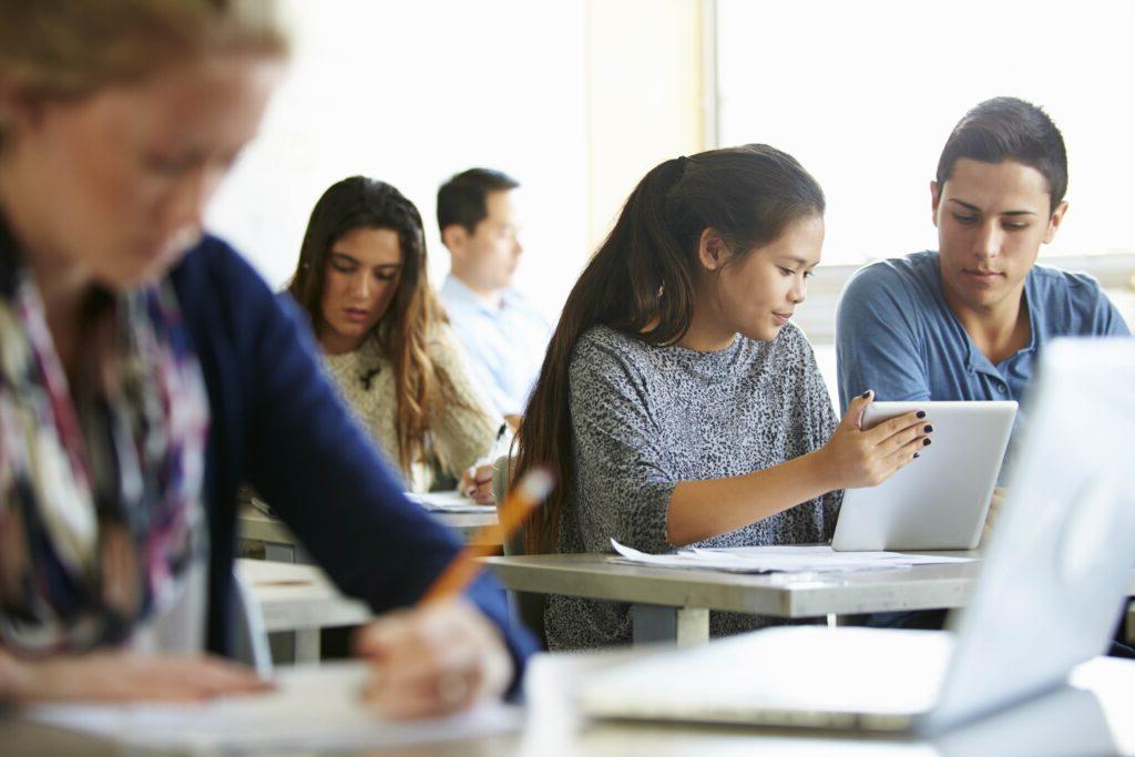 Students working in a classroom on laptops